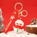 Christmas snowman keychain with red cape and silicone wristlet on winter background - Festive Christmas Snowman