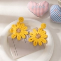Handmade yellow raffia flower earrings in a woven daisy design for beach vacation style - Yellow