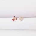 Detail of asymmetric Christmas earrings with candy cane and golden snowflake designs - Snowflake and Candy Cane Stud Earrings
