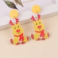 Detailed close-up of acrylic Christmas reindeer earrings with glittery golden finish - Yellow Deer