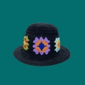 Handmade black crochet bucket hat featuring colorful vintage flower patterns on green back - One Size / Black Dopamine Hat