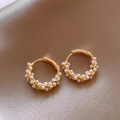 Elegant twisted gold earrings with small pearl inlay on luxury champagne silk background - E5170 Gold Entwined Small Pearl Hoop Earrings