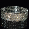 Macro view of four-row rhinestone elastic bridal bracelet with shimmering silver finish - 5 Row Silver Clear Rhinestone Bracelet