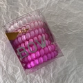 Pink gradient spiral hair ties in a clear gift box with silver Bow typography detail - Pink