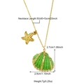 Detail of a gold starfish and green shell pendant with dimensions on a fine chain necklace - Green