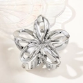 Detailed view of silver hollowed frangipani hair claw clip with smooth metallic finish - 7.5cm Hollow Frangipani / Silver