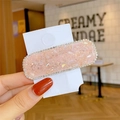 Pink crystal candy-colored rectangular hair clip with small rhinestones and hand-held view - Pink