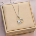 Elegant silver heart pendant necklace with shimmering zircons on a jewelry display box - Silver White Zirconia Heart