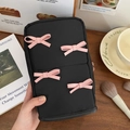Cute black cosmetic bag with pink bows and large capacity for skincare storage - Bow Storage Pouch