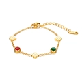 Detail of 18K gold-plated stainless steel bracelet with red green stones and clover charms - Gold Four-Leaf Clover Gemstone Bracelet