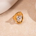 Detailed macro of vintage gold ring with large marquise-cut zircon on stone texture - Gold Rhombus