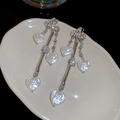 Detail of silver tassel earrings featuring baroque heart pearls and sparkling rhinestones - Butterfly Heart Tassel Style / Silver/White