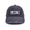 Detail shot of the 3D MINI alphabet embroidery on washed grey cotton baseball cap - Kids MINI Style / Black
