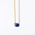 Luxurious gold necklace featuring a large rectangular blue gemstone with enamel accents - Blue Zircon Pendant Necklace