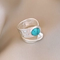 Silver open ring with hammered texture and centered turquoise stone on silk fabric - Silver Turquoise Hammered Style (55#)