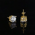 Macro shot of gold four-prong stud earrings with round brilliant cubic zirconia stones - 4mm / Gold