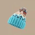 Detail of warm blue knitted hat featuring colorful pompom and geometric patterns - M (56-58cm) / Light Blue