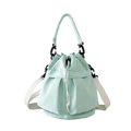 Mint green nylon drawstring bucket bag with white crossbody strap and top handle - One Size / Mint Green