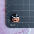 Miniature Halloween pumpkin wizard resin charm showing 1.3cm size detail on cutting mat - Black Triangle Hat Pumpkin