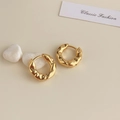 Detailed macro view of 18K gold plated irregular liquid metal texture hoop earrings - 18K Gold Plated Golden Textured Hoop