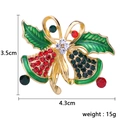 Christmas jingle bell brooch with holly leaves in gold alloy and vibrant rhinestones - Green Woven Ball with Bell