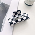 Minimalist black and white checkerboard hair claw clip made of acetate on desk - 7.5cm / Black & White Checkerboard