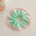 Close-up of mint green scrunchie with pink and white floral crochet lace trim - Mint Green Lace Style / Green