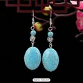 Vintage turquoise drop earrings with silver flower detail and ethnic style hooks - 15-Small Flower Oval Turquoise