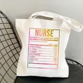 White canvas tote bag featuring a colorful rainbow nurse nutrition facts print design - Style C10 (No Inner Pocket/No Zipper)