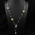 Long gold sweater necklace with freshwater pearl flowers and yellow gemstone accents - Flower Embellished Long Necklace