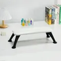White leather manicure footrest with black matte legs on marble surface - Pearl White (Sheet Metal Black Legs)