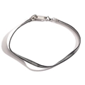 Close-up of a punk style zipper necklace with silver teeth and black fabric band - Silver