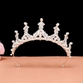 Detailed close-up of a silver baroque crown with white pearls and sparkling rhinestones - No.15 Silver (White Stone)