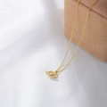 Golden S925 silver zodiac necklace with diamond-set geometric pendant on jewelry box - Aquarius Gold Plated