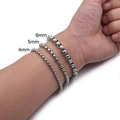Men's titanium steel box chain bracelets in 4mm 5mm and 6mm widths shown on wrist - Box Chain 5mm