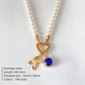 Elegant pearl necklace with 14K gold-plated K initial and blue crystal pendant charm - Letter K