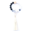 Detail of beaded keychain bracelet with marble beads and cream-colored leather tassel - Style 28 (Black White Marble Beige Tassel)