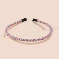 Close-up of glitter sequins on a thin festive headband with black protective tips - Deep Multicolor