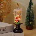 Christmas candle snow globe lamp with Santa Claus figure and gold glitter inside - Small Tall Candle Calling Santa