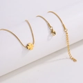 Detailed view of golden clover pendant necklace with sleek snake chain and lobster clasp - Gold Clover Necklace