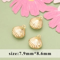 Three golden metal shell pendants sized 7.9mm by 8.6mm for DIY jewelry making - Golden Shell
