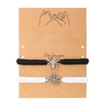 Detail of hand-woven Halloween spider web bracelets with charms on a message gift card - Spider + Spider Web / Black & White 2-Piece Set