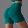 Seamless high-waisted yoga shorts in deep teal with scrunch butt lifting detail - Dark Green