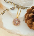 Elegant gold pendant necklace with purple sunflower crystal design on white stone - Rotating Round Multi-petal Flower (XL1196)