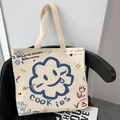 Cream canvas tote bag with blue smiley cloud graphic and wide beige webbing handles - Sunflower and Smiley Face - Beige