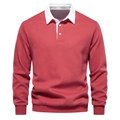 Detail von weißem Polo-Kragen und gerippten Ärmelbündchen am ziegelroten Sweatshirt - S / Lederrot
