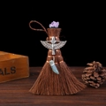 Macro detail of Wicca mini broom with amethyst crystal, winged goddess and green pendant - Style 3