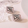 Polished silver croissant hoop earrings with a spiral texture in a minimalist aesthetic - Silver