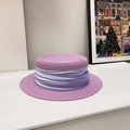 Detail of purple flat top straw hat featuring a refined pleated ribbon and woven texture - Purple/Same Color Ribbon