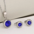 Silver stainless steel jewelry set featuring round blue birthstone necklace and stud earrings - Silver + Blue Zirconia